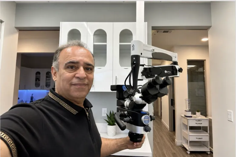 Mo Akhbari, OC Dental Repair technician, installing a dental operating microscope in an Orange County dental office