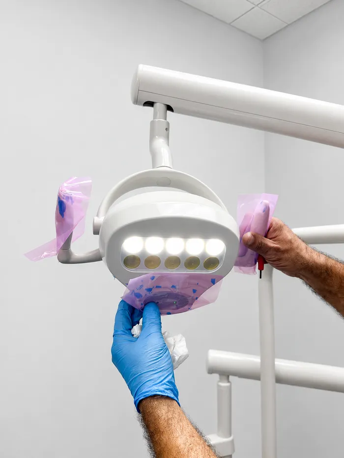 Dental operatory light bulb service with sterile barrier sleeves, Orange County