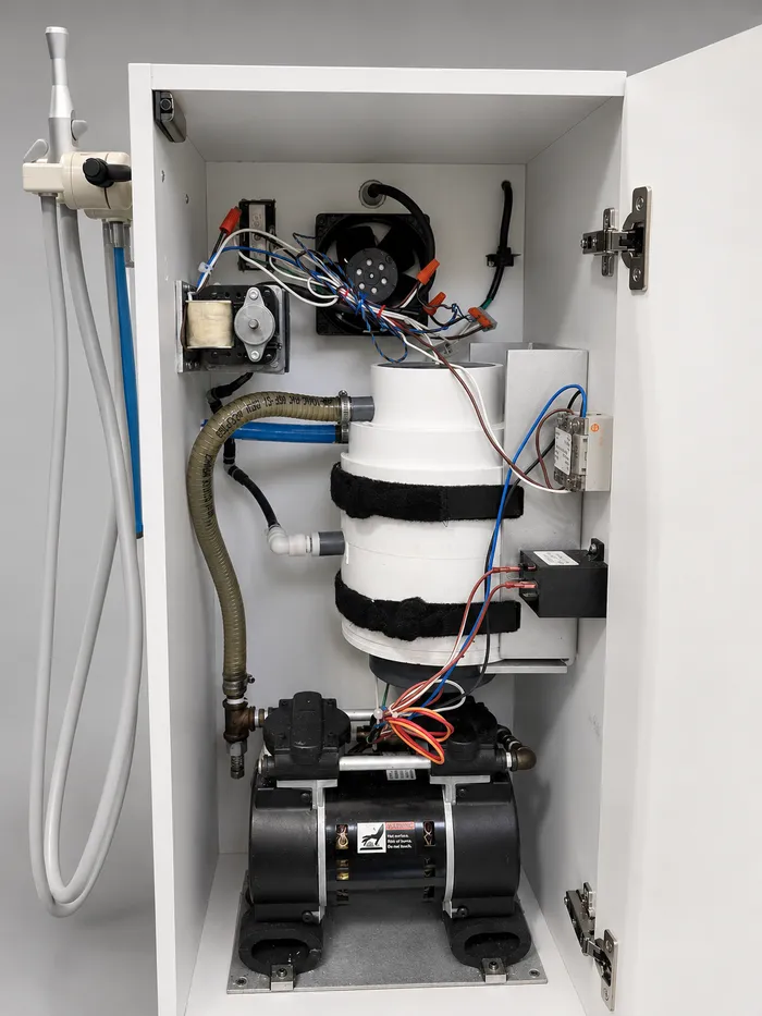 Dental vacuum pump and cabinet-mounted equipment service